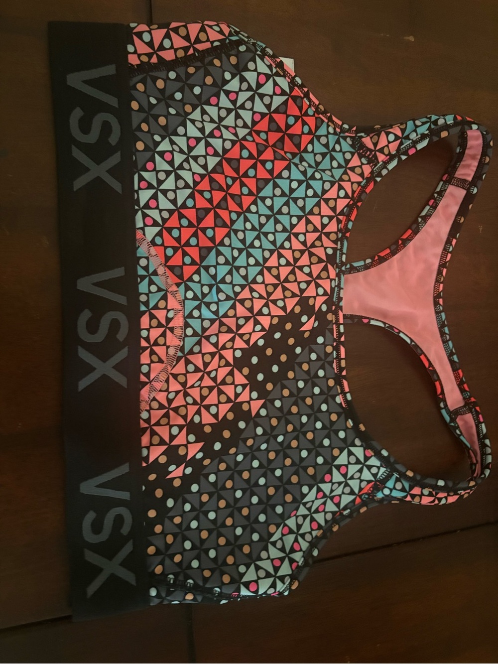 2 womens sports bras/ under armour and vsx size L